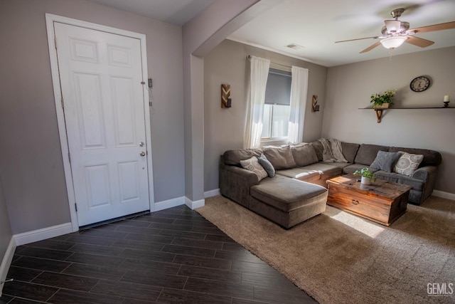 1850 Verdugo Ln, Bakersfield, CA 93312 - living room with arched walkways, dark wood finished floors, and a ceiling fan