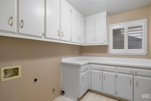 washroom featuring cabinet space, hookup for an electric dryer, and hookup for a washing machine