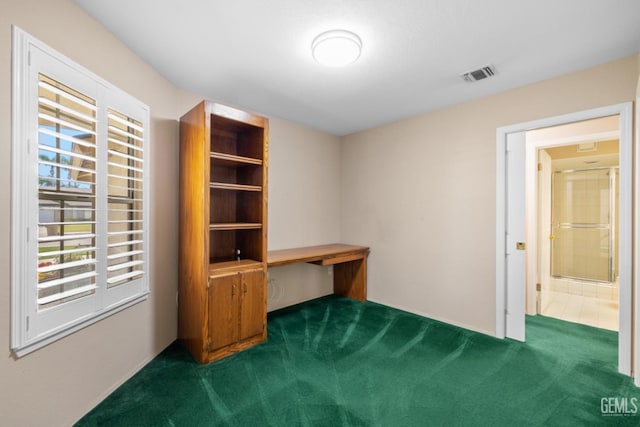 unfurnished office featuring visible vents and carpet