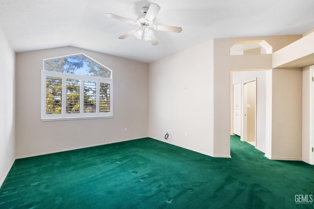 unfurnished room featuring a ceiling fan, lofted ceiling, and carpet