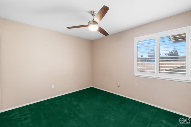 empty room featuring baseboards, a ceiling fan, and carpet flooring