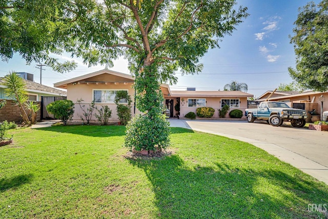 ranch-style house with a front yard