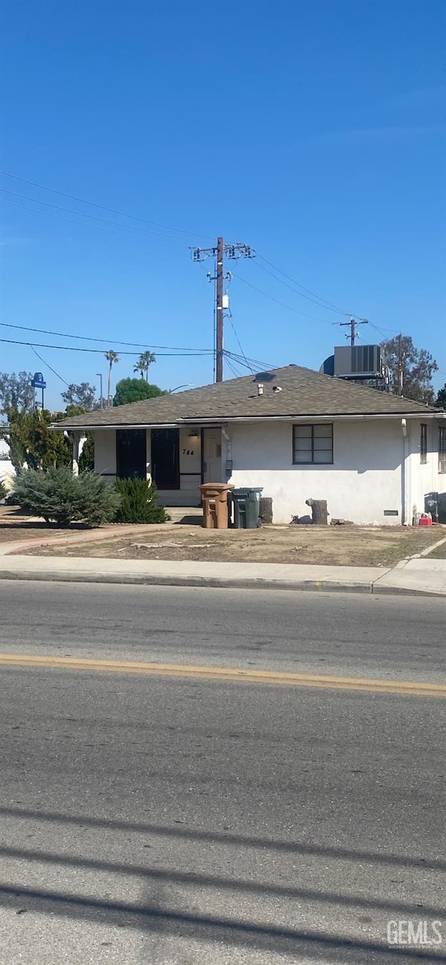 ranch-style house with stucco siding