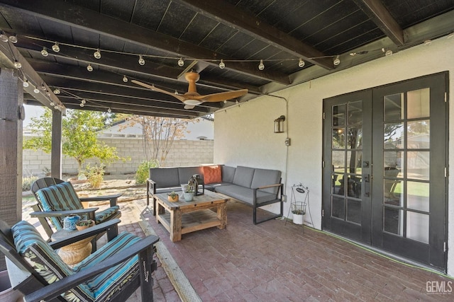 view of patio / terrace with an outdoor living space and french doors