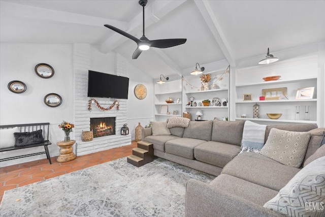 living room featuring a fireplace, lofted ceiling with beams, tile patterned floors, and ceiling fan