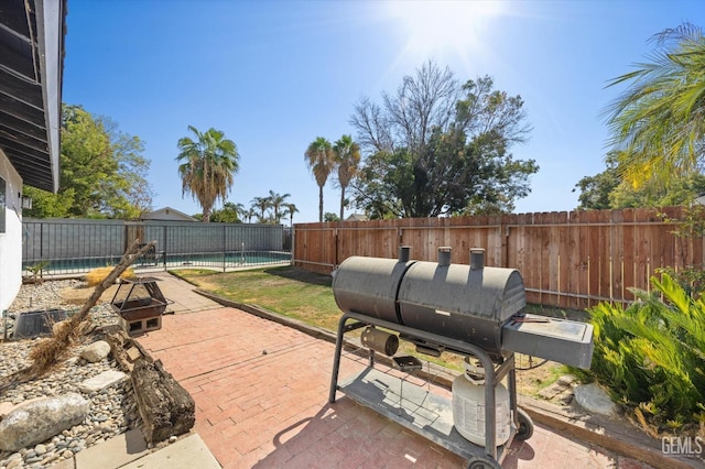 view of patio with a fenced in pool