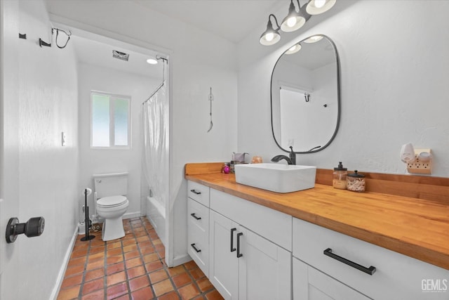 full bathroom featuring vanity, toilet, and shower / bath combo with shower curtain