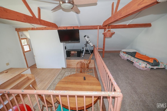 interior space featuring wood-type flooring and ceiling fan