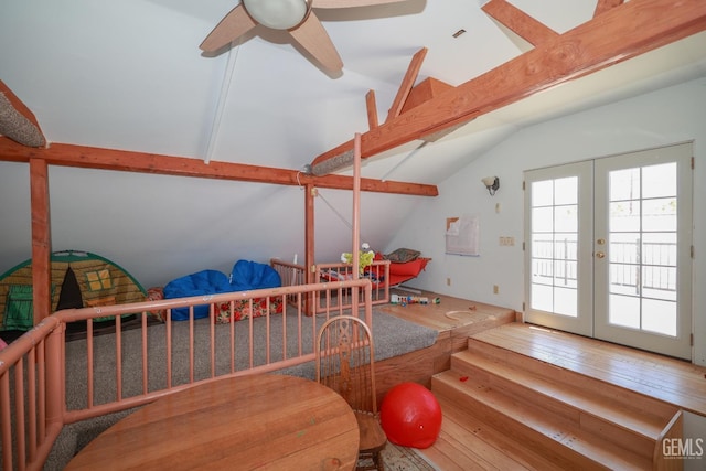bedroom featuring vaulted ceiling with beams, wood-type flooring, french doors, and access to outside