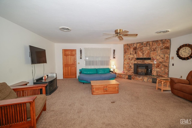 carpeted living room with visible vents and a ceiling fan