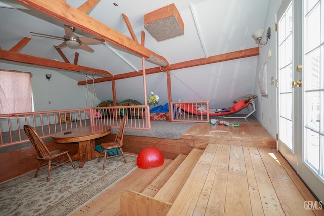 game room with vaulted ceiling with beams, ceiling fan, and hardwood / wood-style floors