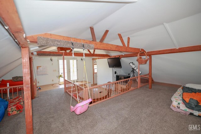 carpeted living room with vaulted ceiling