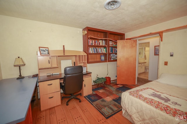 bedroom with light wood-style floors