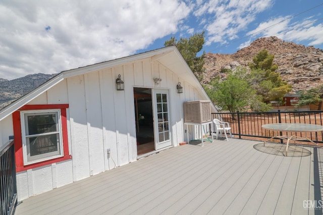 wooden deck featuring a mountain view