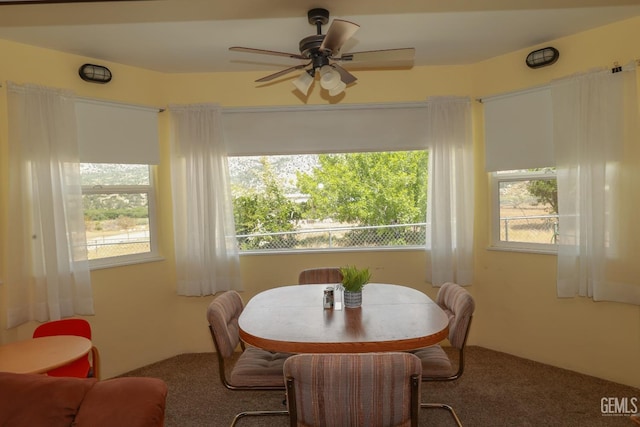 dining room featuring carpet flooring and ceiling fan