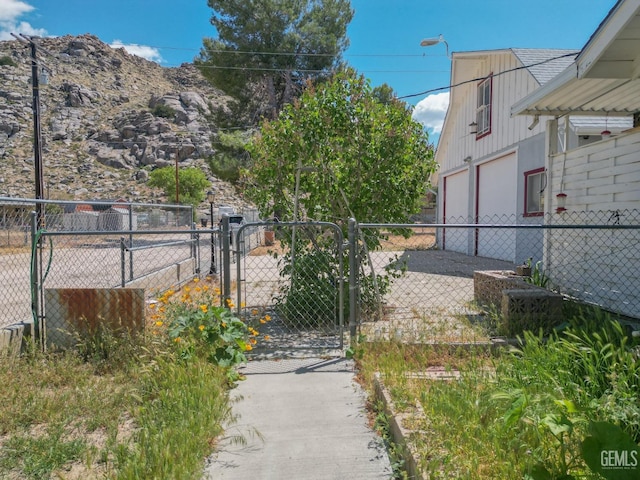 view of gate featuring fence