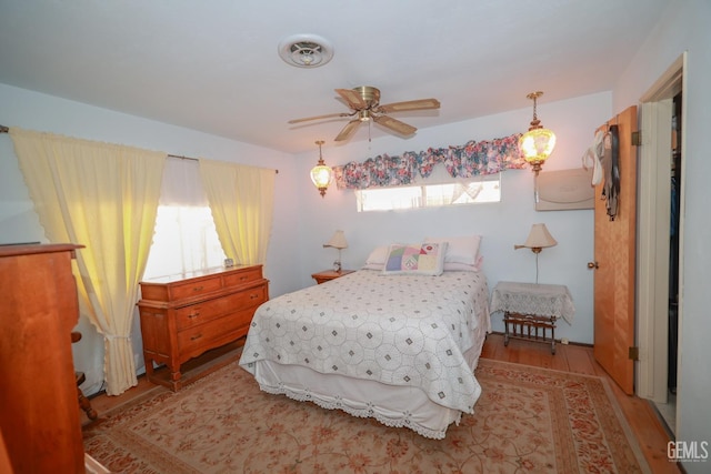 bedroom featuring visible vents and light wood-style flooring