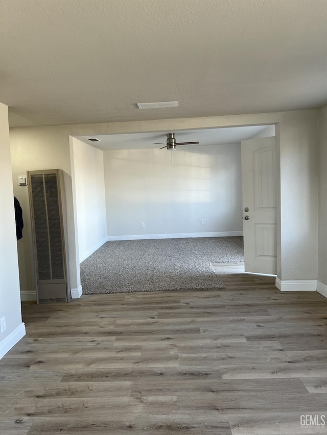 unfurnished room with light hardwood / wood-style floors