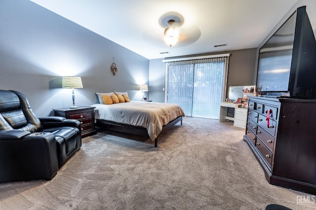 bedroom featuring light carpet, ceiling fan, and visible vents