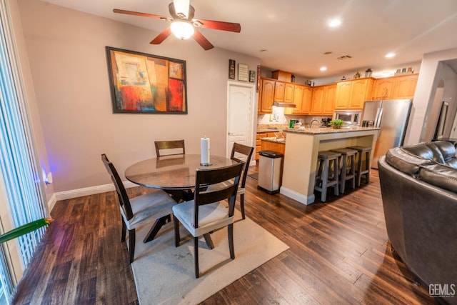 dining space featuring dark wood-style floors, recessed lighting, baseboards, and a ceiling fan