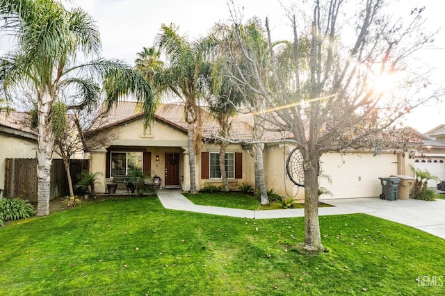 view of front of property with concrete driveway, fence, a front lawn, and stucco siding