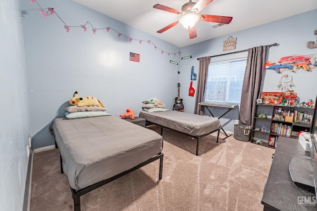 bedroom with carpet, visible vents, and ceiling fan