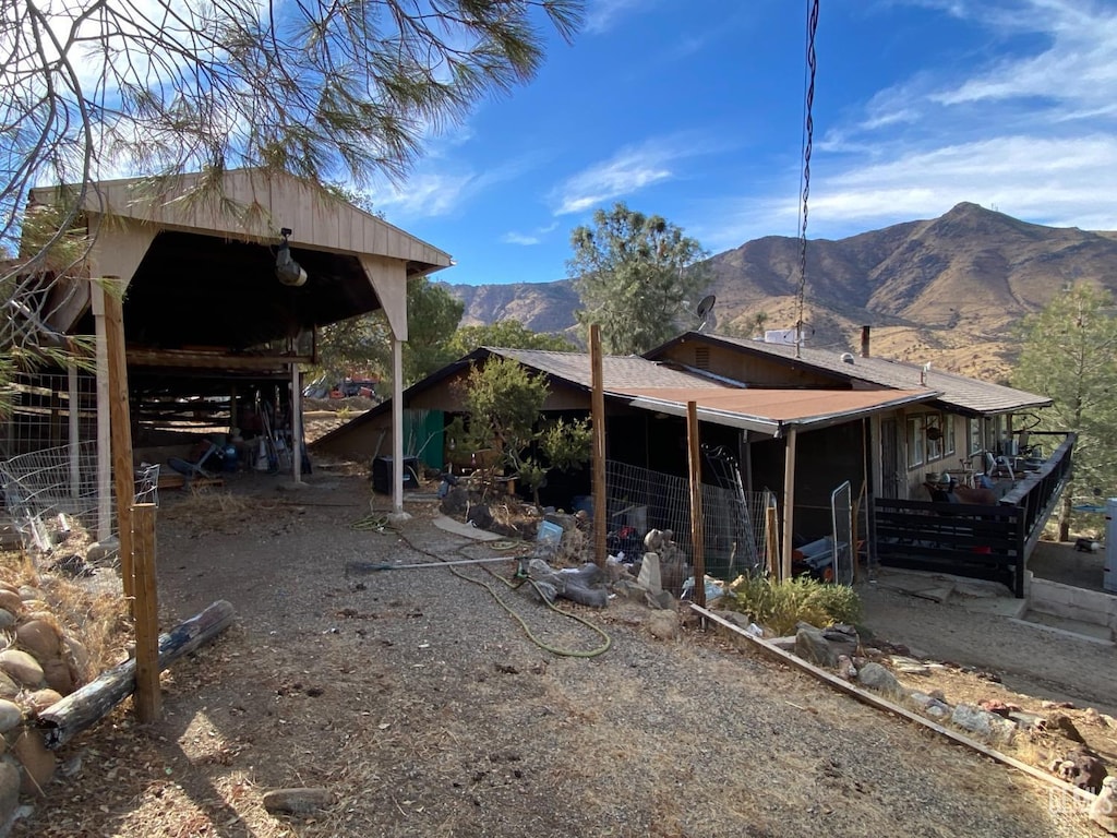 exterior space with an outbuilding and a mountain view