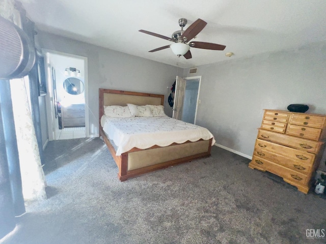 unfurnished bedroom featuring dark colored carpet and ceiling fan