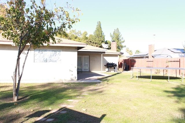 view of yard with a patio area and a trampoline