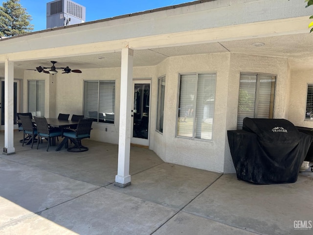view of patio featuring cooling unit, a ceiling fan, outdoor dining area, and area for grilling