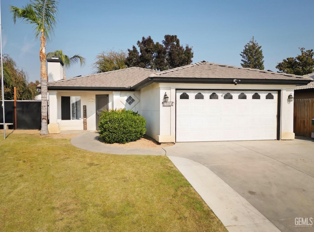 ranch-style home with a front yard and a garage