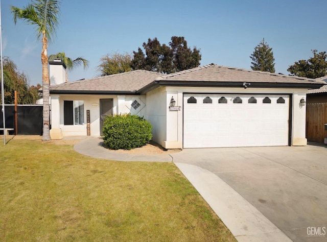 ranch-style home with a front yard and a garage