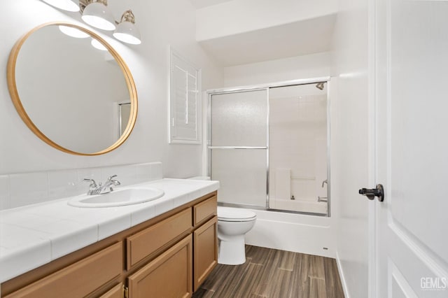5219 Port Dr, Bakersfield, CA 93312 - full bath featuring vanity, combined bath / shower with glass door, and wood finished floors