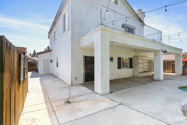 5219 Port Dr, Bakersfield, CA 93312 - view of front of property with a patio, stucco siding, and a balcony