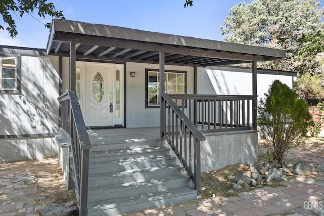 doorway to property with covered porch