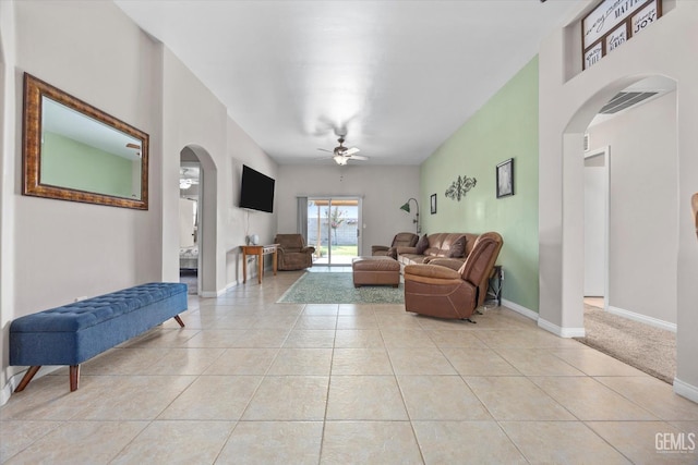 3601 Villa Lante St, Bakersfield, CA 93308 - living room with arched walkways, a ceiling fan, and light tile patterned floors