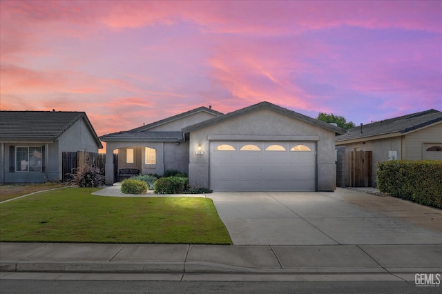 3601 Villa Lante St, Bakersfield, CA 93308 - ranch-style house featuring an attached garage, driveway, and stucco siding