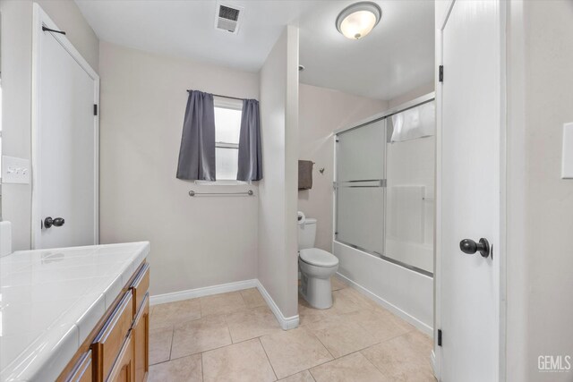 3601 Villa Lante St, Bakersfield, CA 93308 - bathroom featuring vanity, bath / shower combo with glass door, and tile patterned flooring