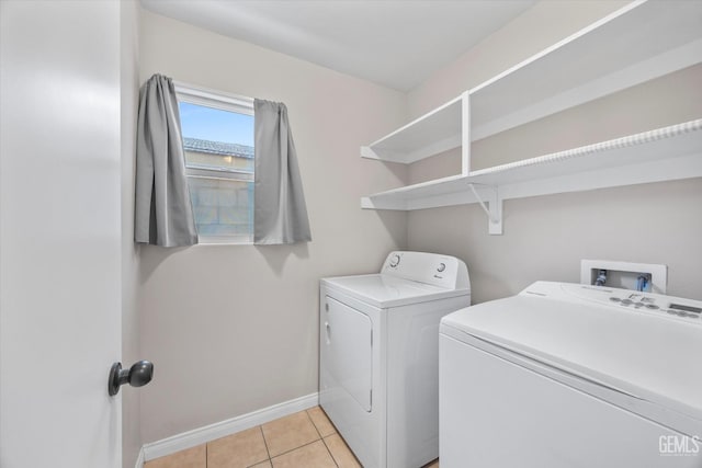 3601 Villa Lante St, Bakersfield, CA 93308 - laundry room with washing machine and dryer and light tile patterned floors