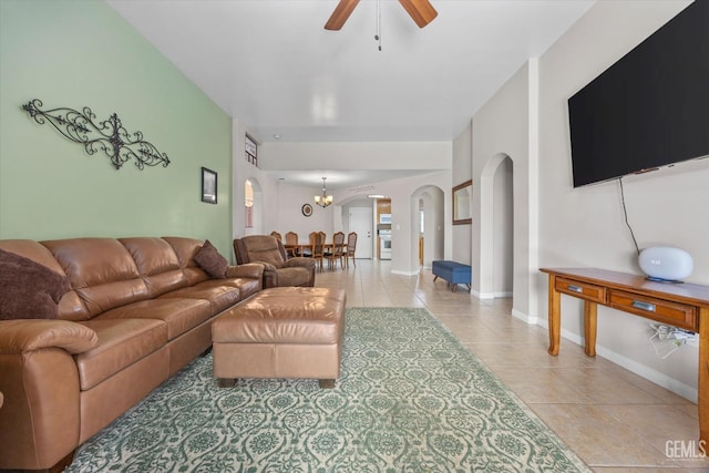 3601 Villa Lante St, Bakersfield, CA 93308 - living area featuring arched walkways, light tile patterned floors, a ceiling fan, and a chandelier