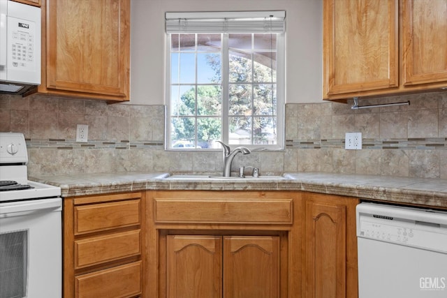 3601 Villa Lante St, Bakersfield, CA 93308 - kitchen featuring white appliances, light countertops, and backsplash