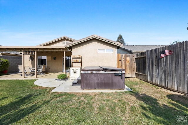 3601 Villa Lante St, Bakersfield, CA 93308 - back of house featuring a hot tub, a patio, a fenced backyard, and stucco siding