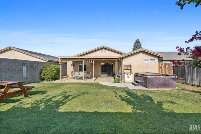 3601 Villa Lante St, Bakersfield, CA 93308 - back of house with a hot tub, a patio area, a fenced backyard, and stucco siding