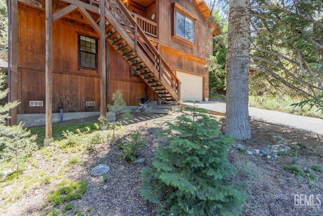 view of property exterior with a garage