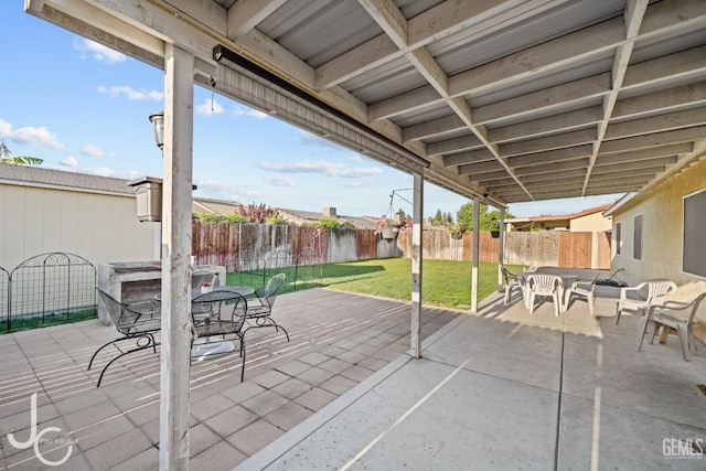view of patio / terrace featuring outdoor dining space and a fenced backyard
