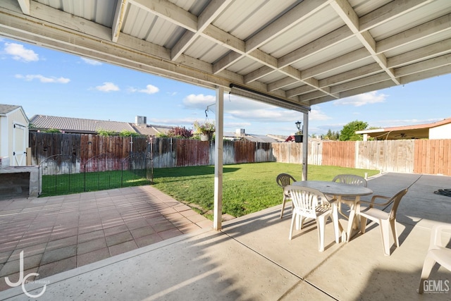 view of patio with outdoor dining space and a fenced backyard