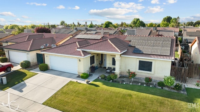 view of front of house featuring fence, stucco siding, a tiled roof, and an attached garage