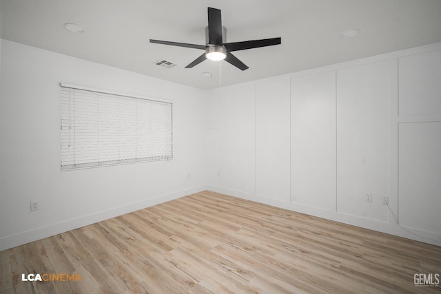 empty room featuring light hardwood / wood-style flooring and ceiling fan