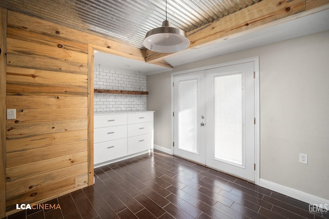 unfurnished room featuring french doors