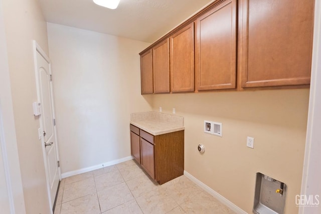 laundry area with hookup for a washing machine and cabinets